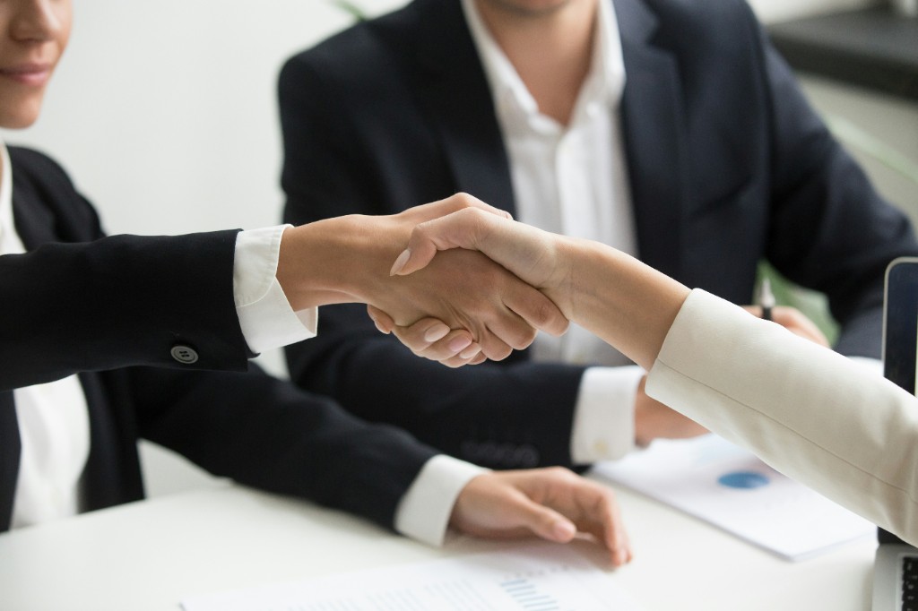 Handshake between property seller and estate agent